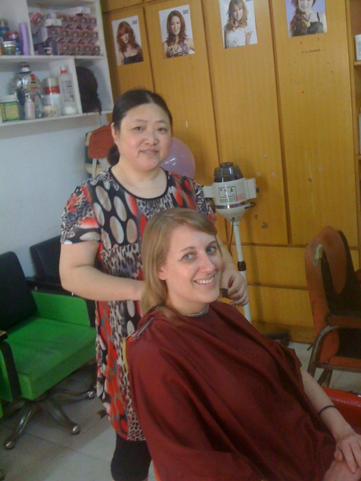 Getting my haircut by the local hairdresser.